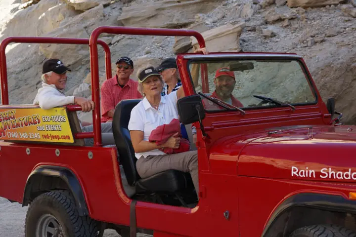 a person riding on the back of a truck