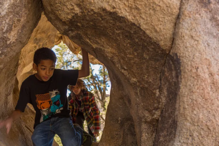 a man riding on top of a rock