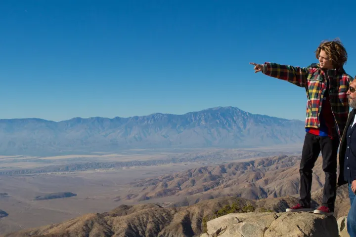 a man standing on top of a mountain