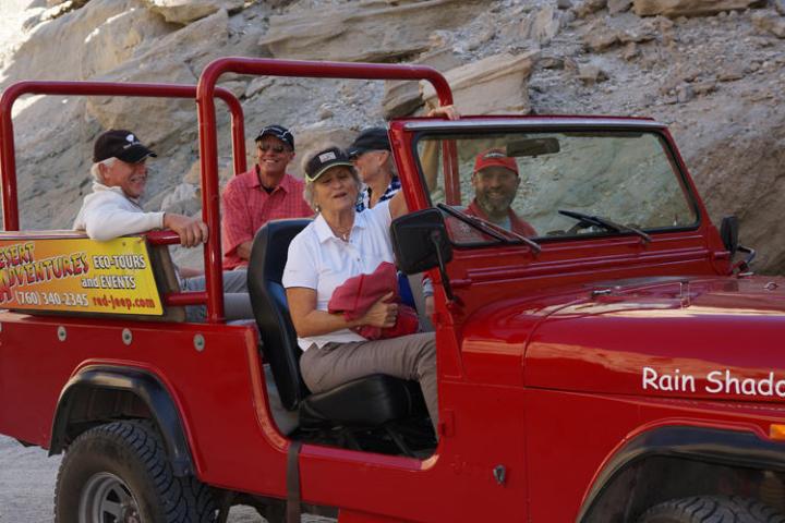 a person riding on the back of a truck