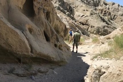 a man standing on a rocky hill
