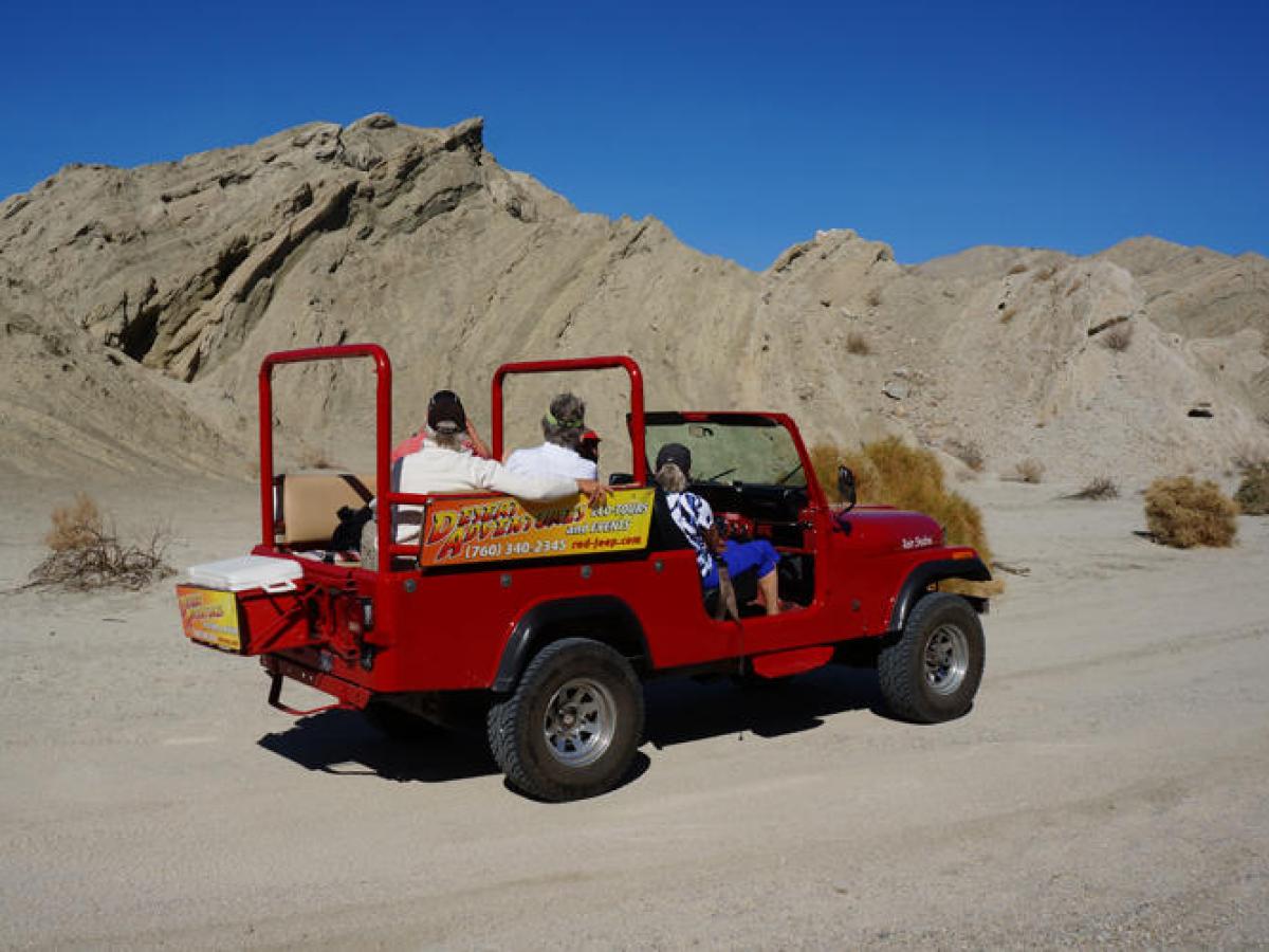 a truck is parked in front of a mountain